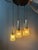 Mid century space age cascade pendant lamp with 5 crystal glass shades. The shades can easily be adjusted in height. The...