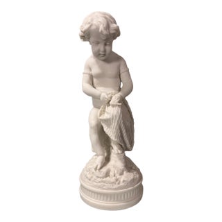 Antique Victorian 13.25" Art Nouveau Figural Parian Statue of a Cherub With Net For Sale