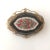 Late Victorian Italian Brooch with a micro-mosaic on black onyx with a centerpiece features a beautifully detailed, multi-...