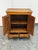 Design Plus Gallery presents a 19th Century Chinese Elmwood Wedding Cabinet. This antique elmwood cabinet has a honey...