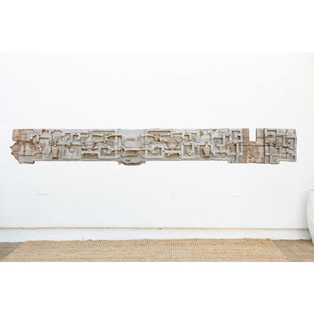 This antique Chinese carved wood panel, possibly dating back to the 19th century, offers a captivating glimpse into the...