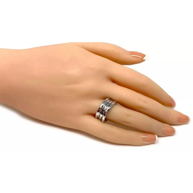 Brand: Bvlgari Hallmark: Bvlgari 750 51 Made in Italy Measurements: Band is 9mm wide x 2.5mm high Material: 18k white gold...