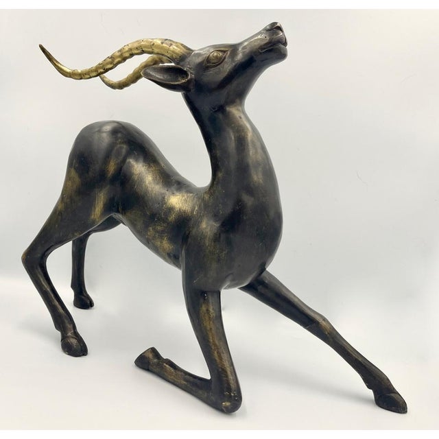 Cracks including to front left leg, antlers. Irrelevant for construction and stability. This piece is attributed to the...