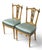 These Louis XVI style side or accent chairs have flora and vine carvings, fluted legs, and silk-like upholstery. Each...