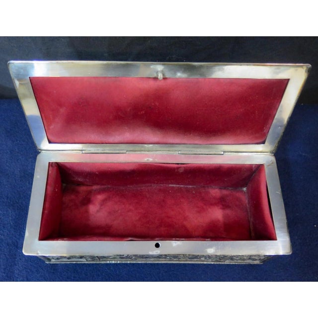 This vintage rectangular ladies silver-plate trinket/jewel box is beautifully designed with various panels showcasing many...
