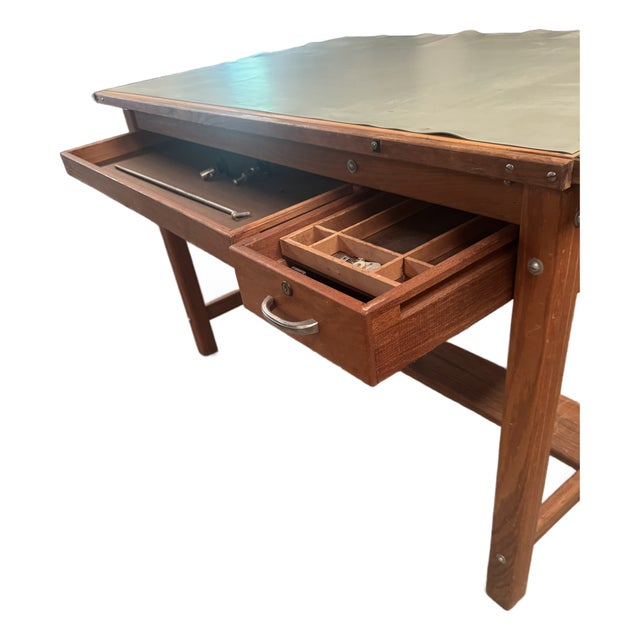 Solid oak Mayline drafting table with drafting pad. Original key is missing, but I can replace the lock prior to shipping...