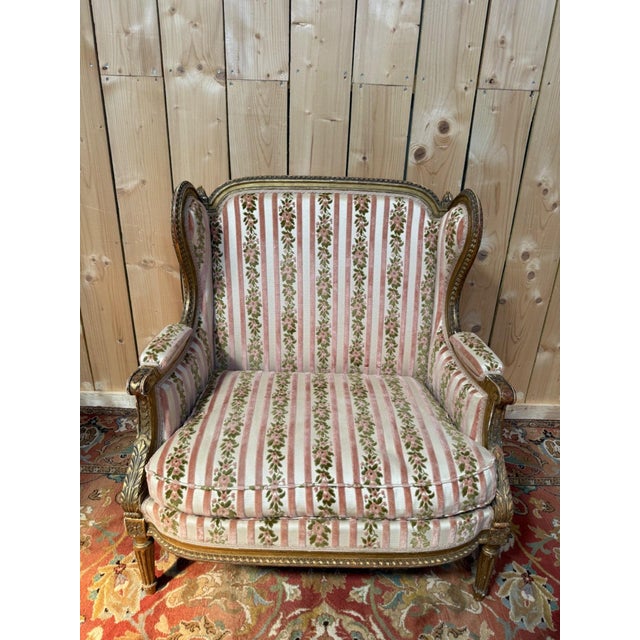Large Louis XVI style wingback armchair in giltwood with original velvet upholstery! The frame is perfectly stable\. Seat...