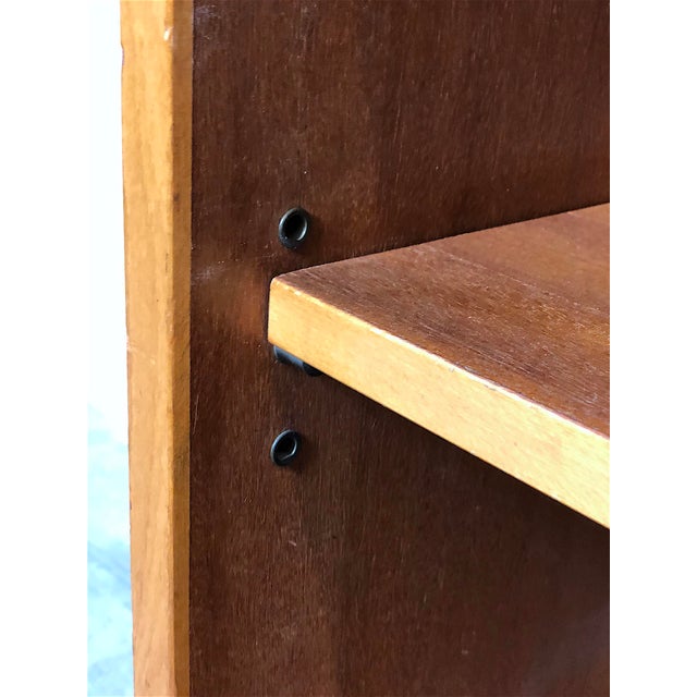 Vintage 1960s cabinet/bookcase, Made in Italy. This compact piece of furniture is perfect for keeping things organized in...