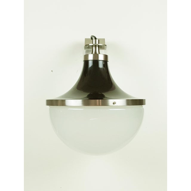 Wall lamp in matt nickel-plated brass. Reflector in dark brown coated aluminum. Frosted glass globe. I have official proof...