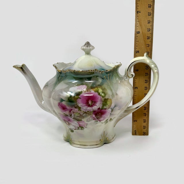 Bring timeless elegance to your porcelain collection with this exquisite antique RS Prussia teapot. Featuring a stunning...