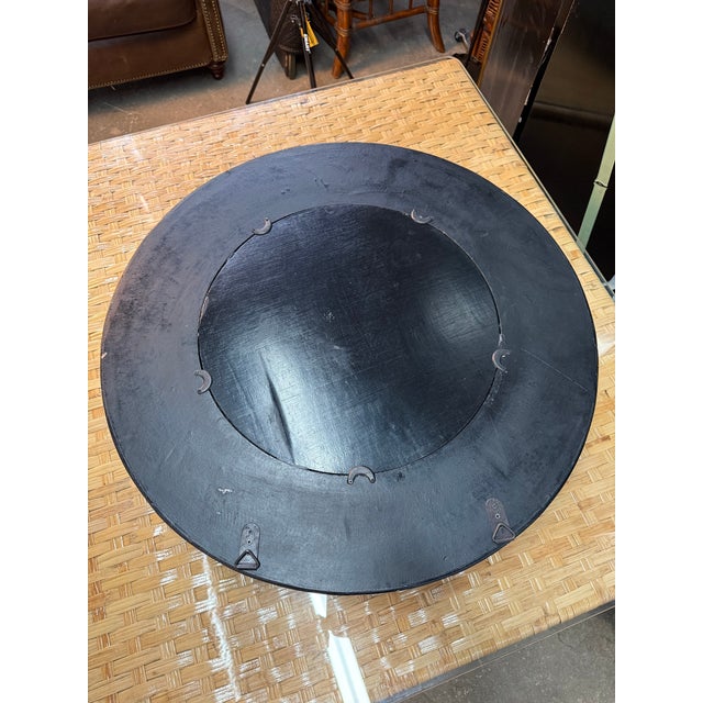 A beautiful round beveled mirror, wrapped in a leather-like distressed finish for a rustic, Ralph Lauren feel. Brass...