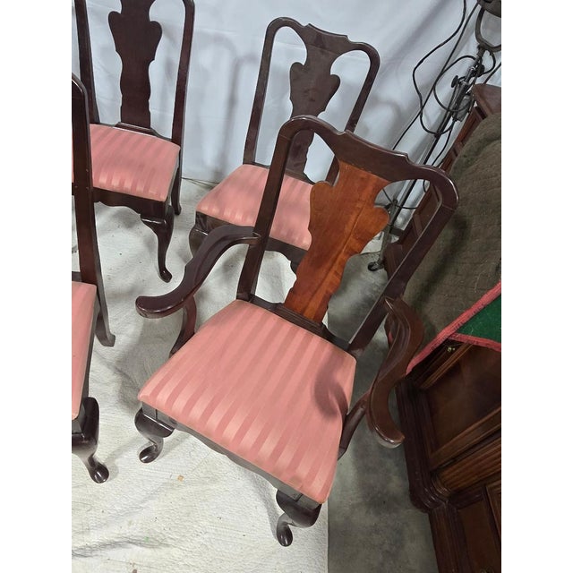 Elegant set of eight Queen Anne style dining chairs, including six side chairs and two captain’s chairs. Crafted in solid...