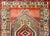 A fantastic mid-20th century Persian Serab rug with two large central diamond medallions each with a stylized central...