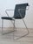 Beautiful Monopoli armchair by Pietro Arosio for Airon. Italy, 1970s. Black lacquered perforated metal frame. Chrome-...