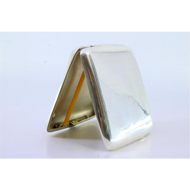 Guilloche Silver Cigarette Case with Curved Bands, in Very Good conditions. Designed 1890 to 1919 This piece has an...