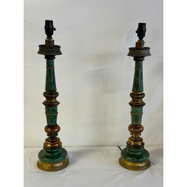 Pair of blue green marble and brass lamps with Asian inspired inscribed detailing and marble bodies. The lamps are in...