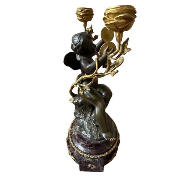 **Exquisite Antique Cherub Candelabra** Elevate your home decor with this stunning antique cherub candelabra, a...