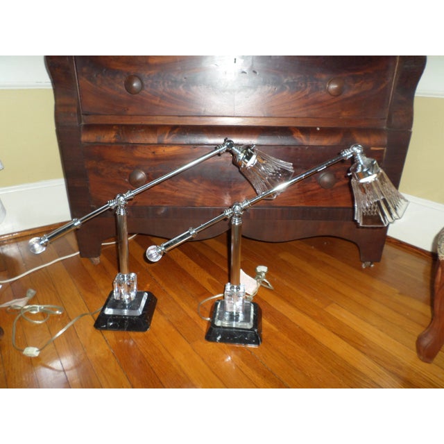 Here is a Gorgeous Pair of Luxury Retro Mid Century Modern Style Table Lamps made of Chrome with a Black Marble and Lucite...