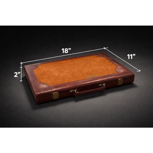 A vintage leather backgammon set with suede playing surface and full leather interior detailing. Compact, complete, and...