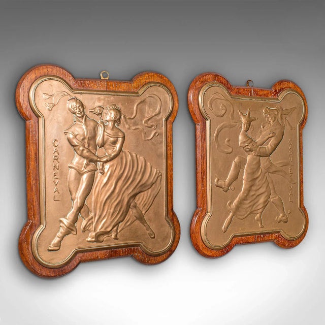 This is a pair of antique carnival plaques. A Venetian, bronze on oak decorative wall plates, dating to the late Victorian...