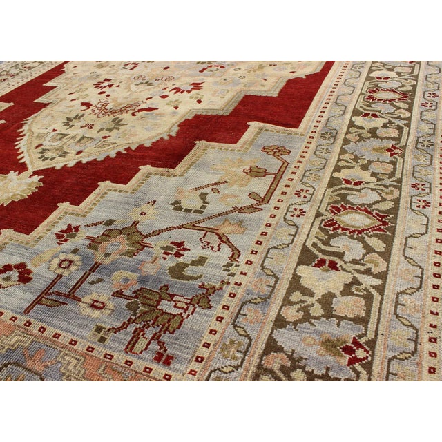 Mid 20th Century Vintage Turkish Oushak Rug With Rich Red, Soft Blue, and Cream Tones For Sale - Image 5 of 9