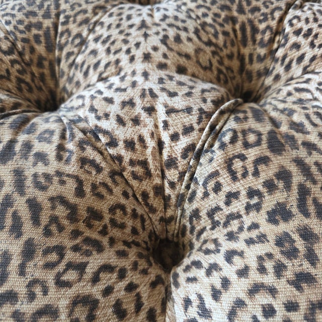 Featured is a Lee Industries Tufted Leopard Print Upholstered Ottoman With Turned Wooden Legs and Casters. The generously...