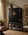 A well-crafted Chinese wedding cabinet by Altfield Hong Kong featuring a richly aged black lacquer finish, classic brass...