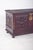 Carved wooden chest with gilded fittings. The top is richly carved with geometric details framing the surface and...