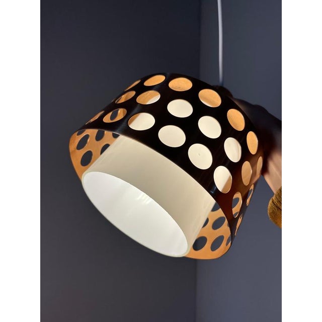 This swedish pendant lamp from the mid-century era shines with its interplay of materials and lighting effects. It...