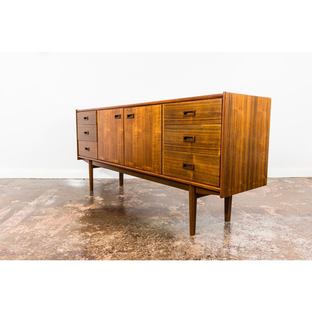 Credenza in walnut veneer from the Type 1059 living room set, manufactured by Bydgoskie Fabryki Mebli in Poland in 1964. A...