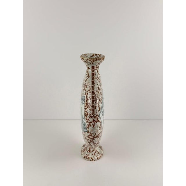 A striking aesthetic movement moon flask by franz anton mehlem, made in germany in 1865, its flattened earthenware form...