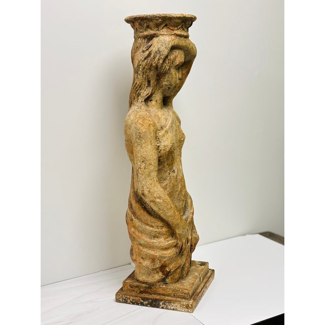 A caryatid is an ancient sculpted female figure serving as an architectural support taking the place of a column or pillar...