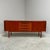 Teak sideboard with 4 drawers and 2 sliding doors, 1960s This piece is designed in the style of the selected designer...