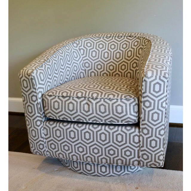 Kravet Swivel Chair upholstered in a beautiful gray and white geometric design. Chair is in good condition with minimal...