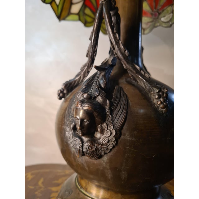 Art Nouveau Bronze Caryatid Lamp with Stained-Glass Glass Shade in the style of Tiffany, 1900s, in Flawless conditions....