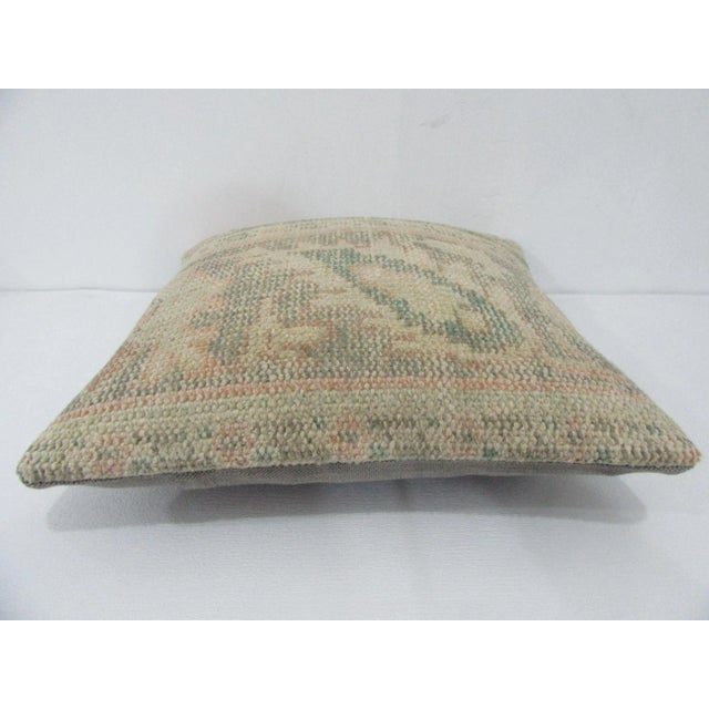 Decorative pillow cover made from a vintage Turkish handknotted rug. Backed with good quality cotton fabric. Pillow...