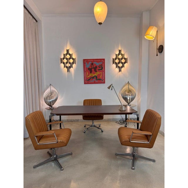 Presenting an expertly restored set of three Osvaldo Borsani office chairs, including an executive model and two visitor...