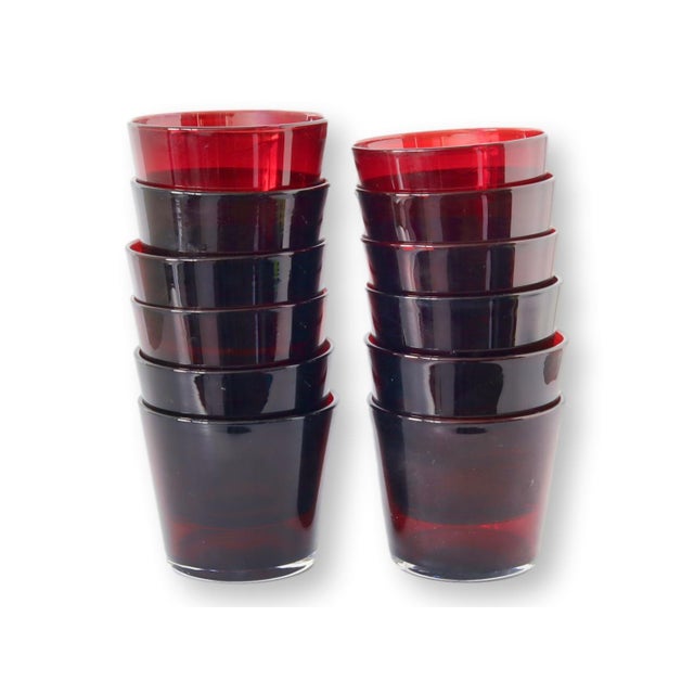 Set of twelve, rich ruby red double old-fashioned glasses, masterfully handblown to perfection. The heavy glass design...