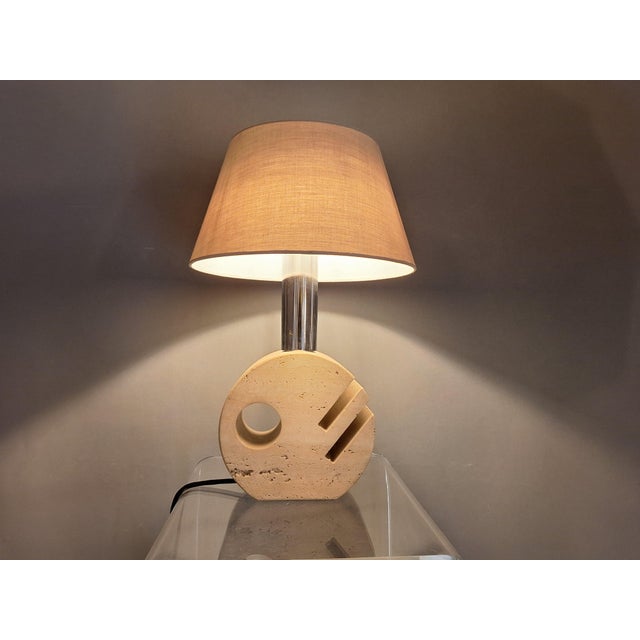 Travertine lamp from the 1960s/70s. New textile cable, cord switch, and plug. Height with shade: 46 cm. Lampshade...