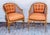 Gorgeous pair of 29 th c faux bamboo tub chairs with cane. Custom upholstery in burnt orange. McGuire style.