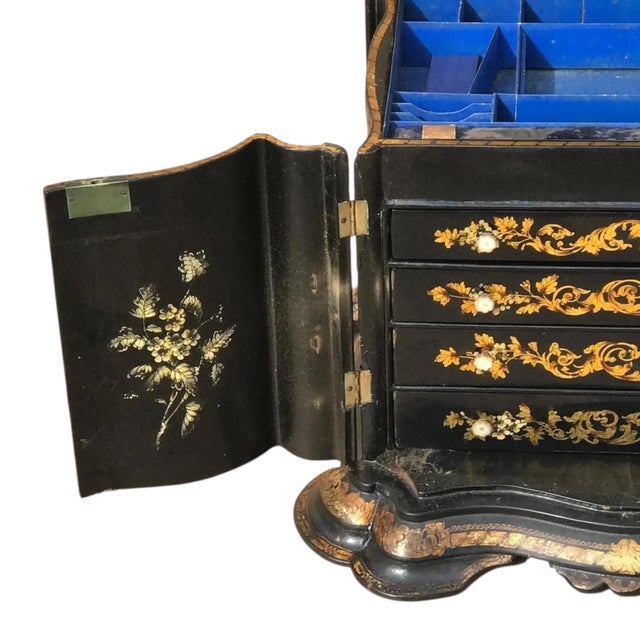 A monumental 19th C. English papier mache jewelry box. Highly decorative with a hand carved scalloped black lacquered...