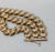 Circa 1950s or 1960s goldtone 3 rows of vs textured like leaves bracelet with slide closure and security chain. It could...