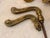 Collection of antique solid brass door handles and escutcheon plates featuring richly detailed designs from the late 1800s...