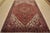 An authentic vintage traditional tribal Heriz rug hand-knotted with fine wool and natural dyes. This rug features a...