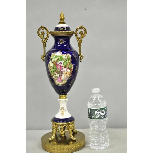 Vintage French Victorian Style Hand Painted Cobalt Blue Decorative Porcelain Urn on Brass Lamp Base. Circa Mid 20th...