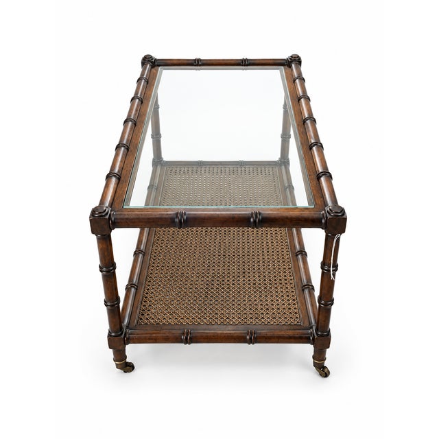 A striking late 20th-century coffee table executing classic Hollywood Regency styling with exceptional modern...