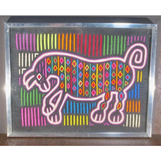 Brightly colored Molas from Panama, Indian Kola. The native traditional geometrical patterns in bright colors are now...