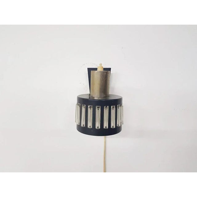 - Small vintage wall light - Reminiscent of the designs from Philips - Produced in The Netherlands during the 1960s - Made...
