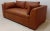 This luxurious Italian full aniline leather sofa, upholstered in 100% top grain leather, offers a rich chestnut brown...