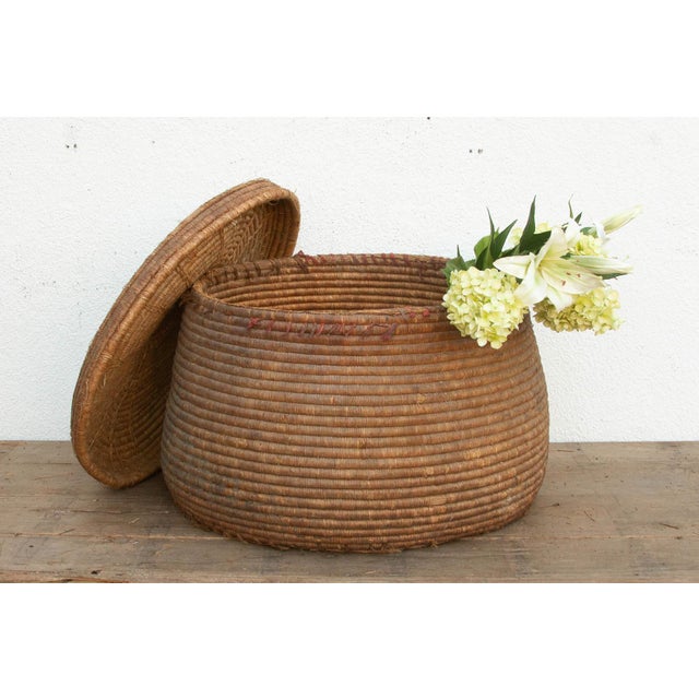 This 26-inch nomadic storage vessel is a masterful example of functional tribal artistry. Baskets of this scale and...